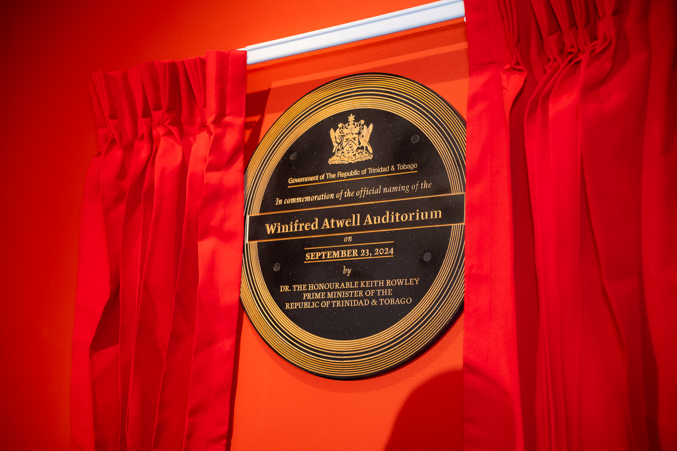 The unveiling of the Dedication Plaque and Building Signature at Queen's Hall's Winifred Atwell Auditorium Naming Ceremony. Photo credit: Stephen Dalchan